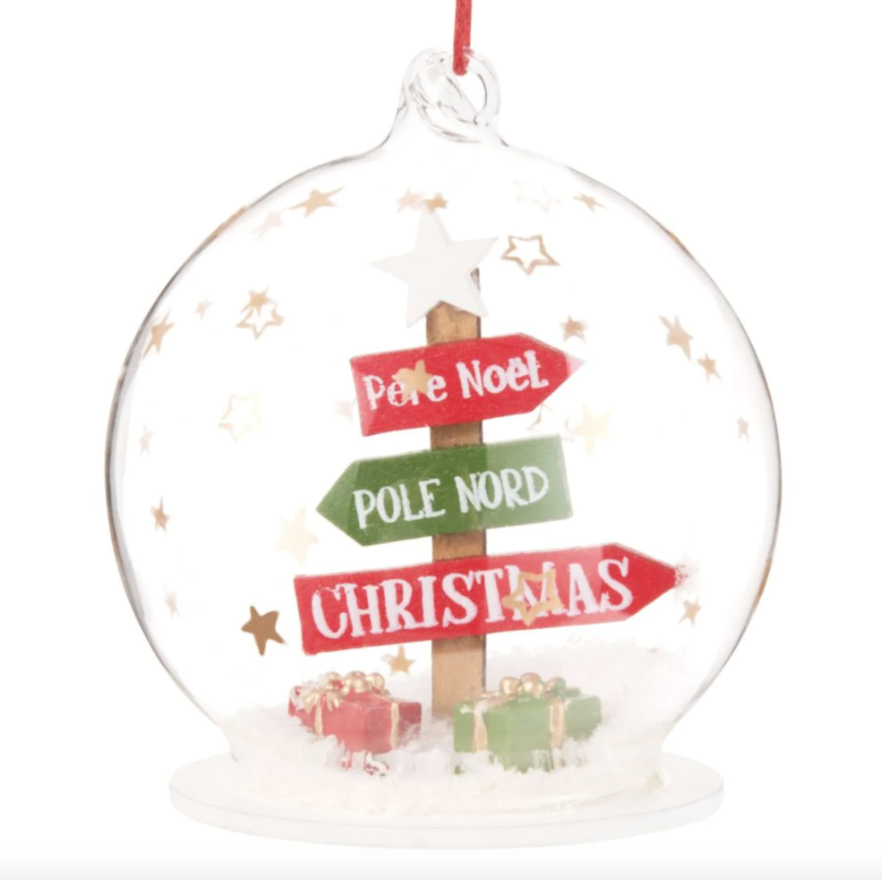 Bola de Navidad de cristal con señales de Maisons du Monde. 
