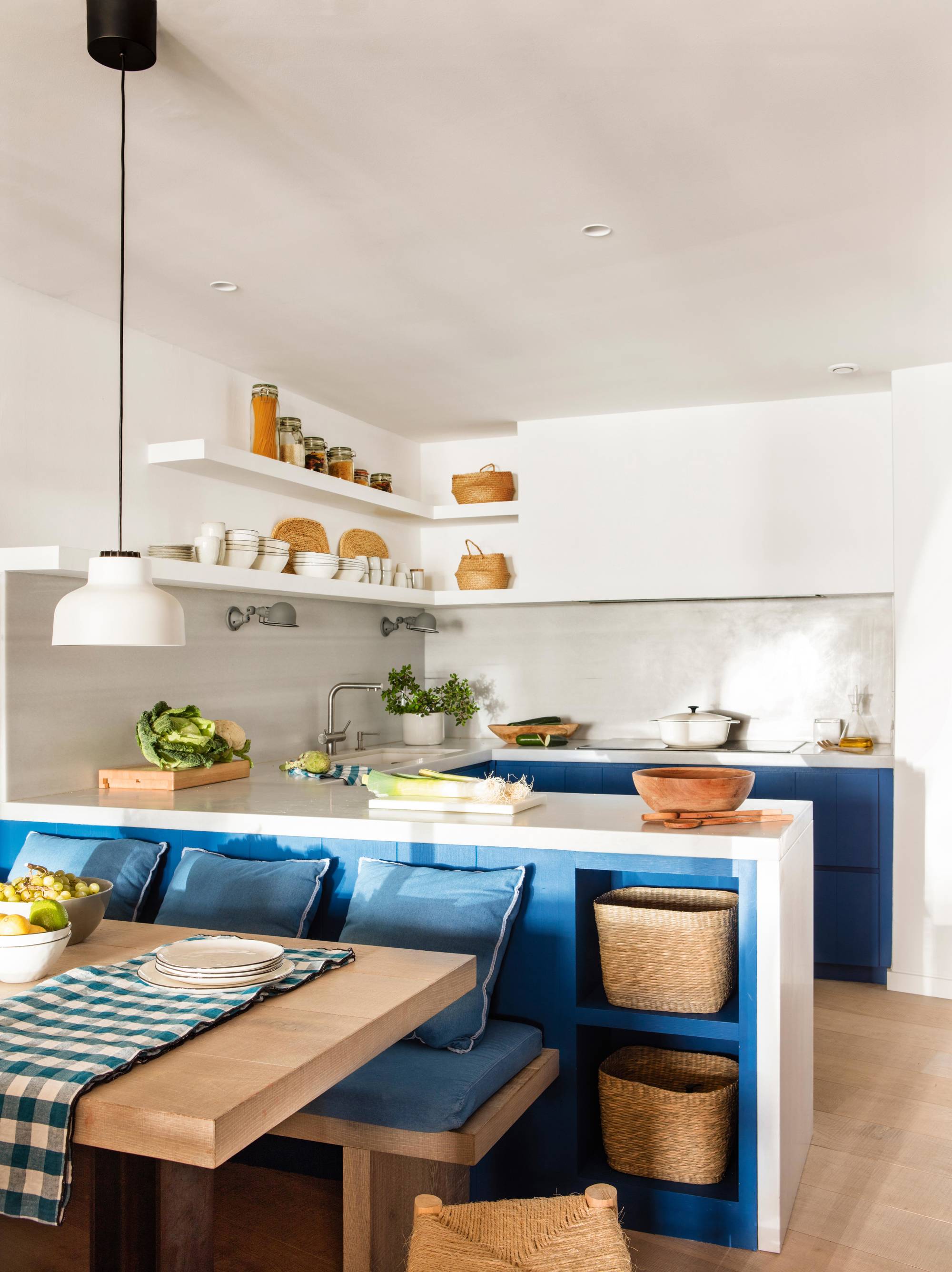 Small white and blue kitchen with office
