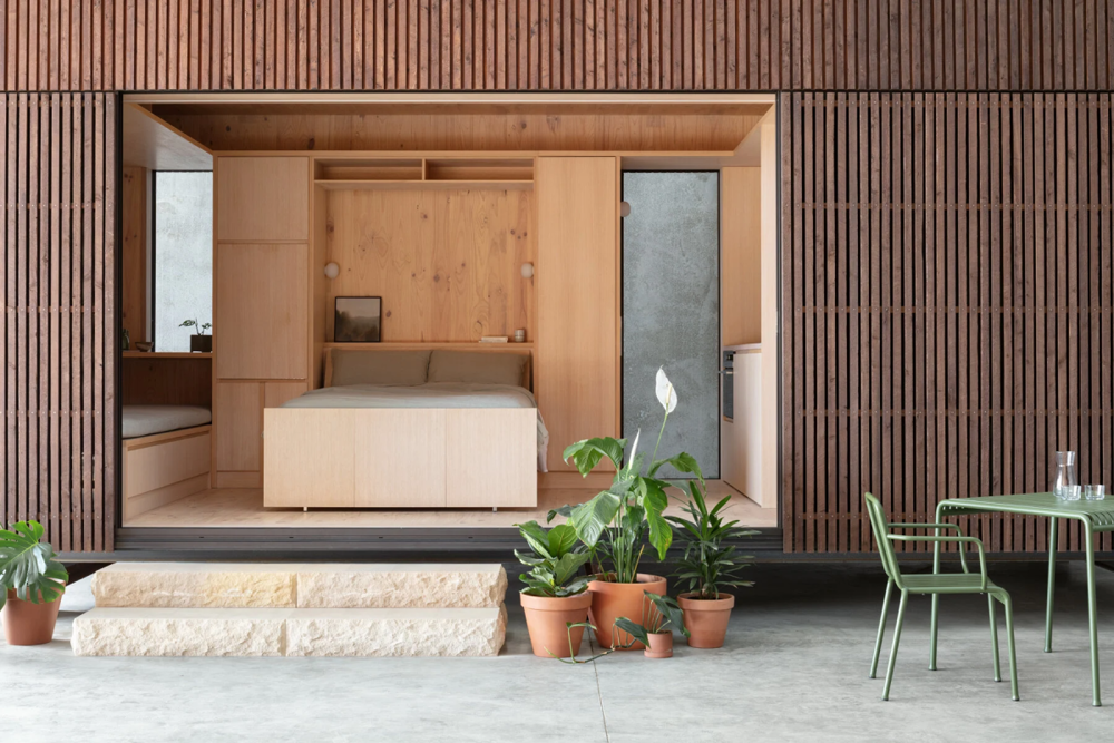 Interior y exterior de la casa Minima prefabricada de madera 