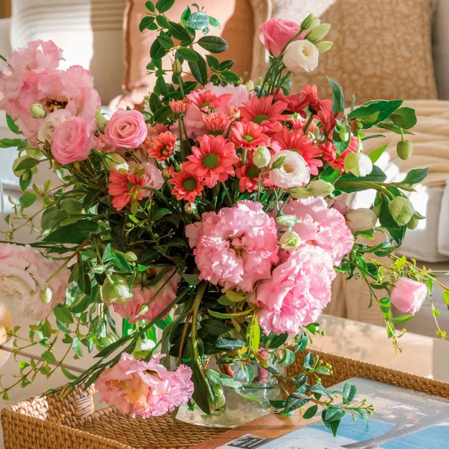 arrangement of reddish flowers and leaves